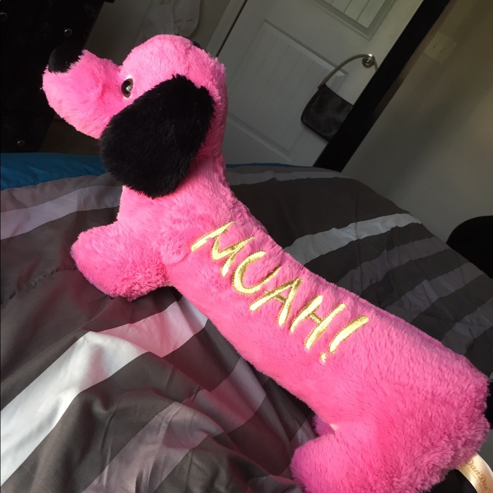 A cuddly pink dog